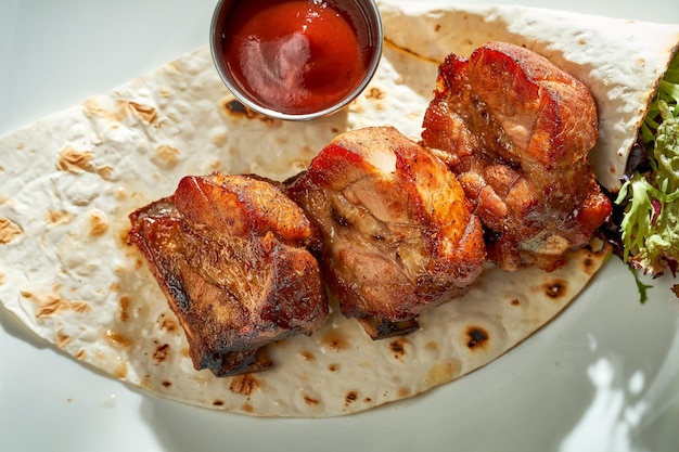 Pork shish kebab on a plate grilled meat hard light selective\
focus