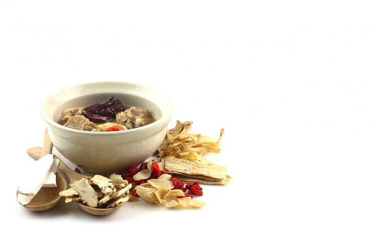 Pork soup with Chinese medicine on white