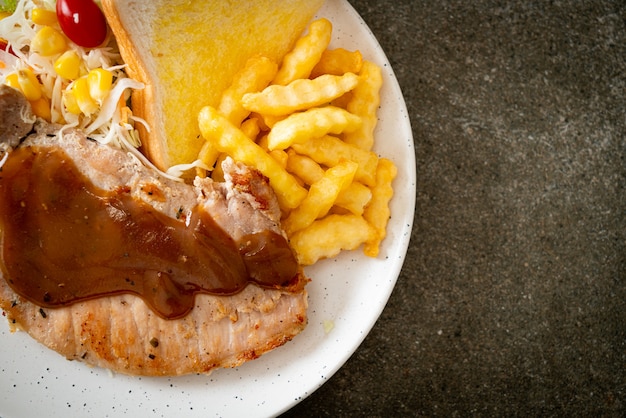 pork steak with black peppers gravy sauce and mini salad