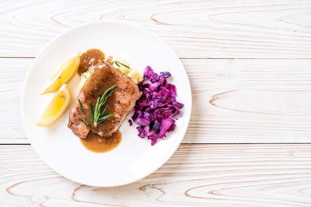 pork steak with red cabbage and mashed potatoes