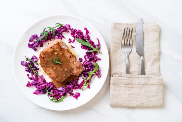 pork steak with red cabbage and mashed potatoes