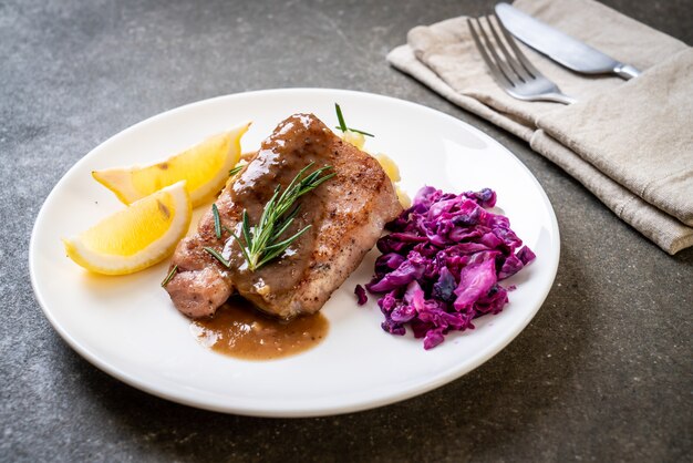 pork steak with red cabbage and mashed potatoes