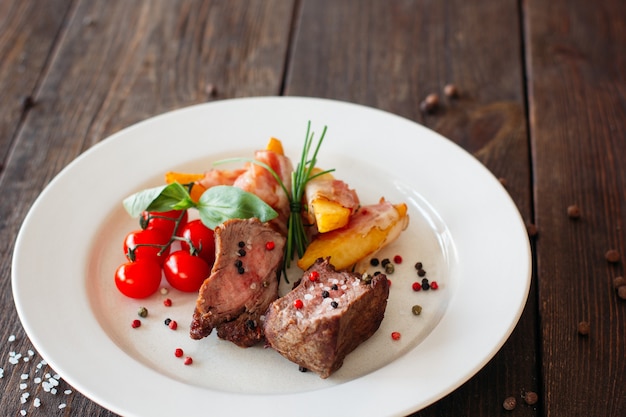 Pork steak with spices and vegetables.