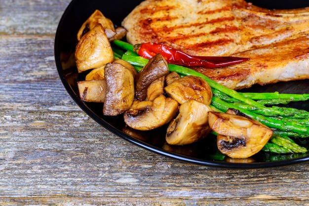 Pork steak with vegetables and mashrooms