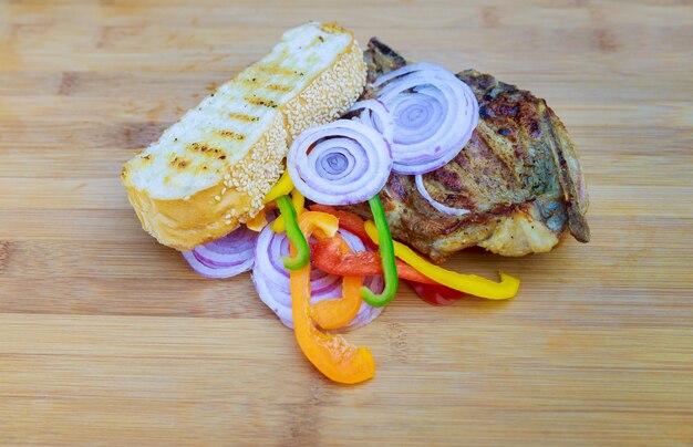 Pork steak on wooden dark tone background