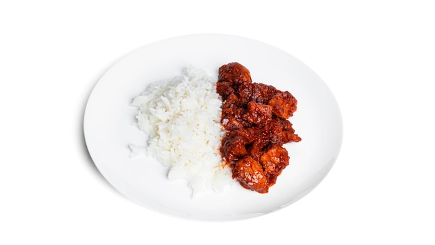 Pork stew with rice on white plate isolated on white. Goulash with rice. Rice with meat.