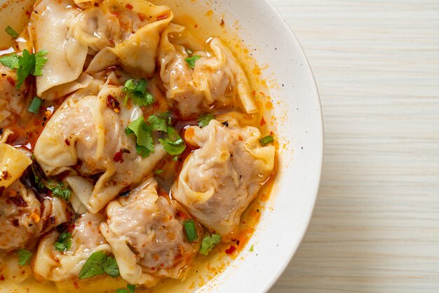 pork wonton soup or pork dumplings soup with roasted chili - Asian food style