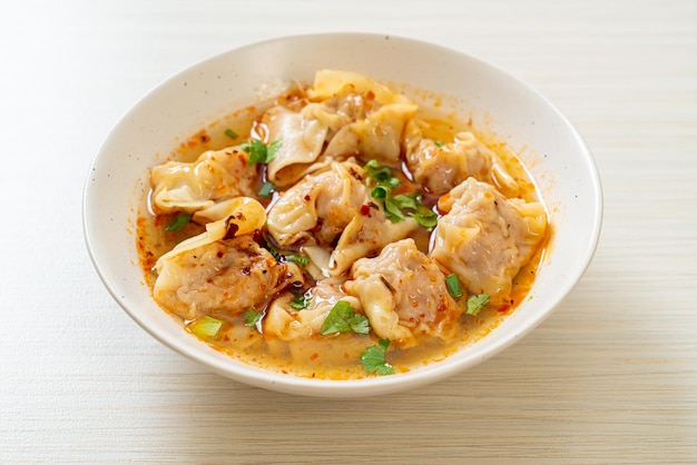 pork wonton soup or pork dumplings soup with roasted chili - Asian food style