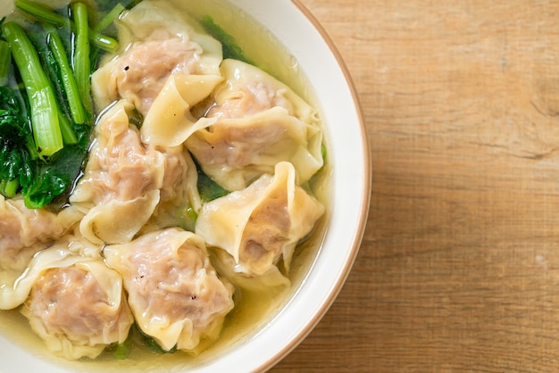 pork wonton soup or pork dumplings soup with vegetable - Asian food style