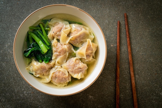 pork wonton soup or pork dumplings soup with vegetable - Asian food style