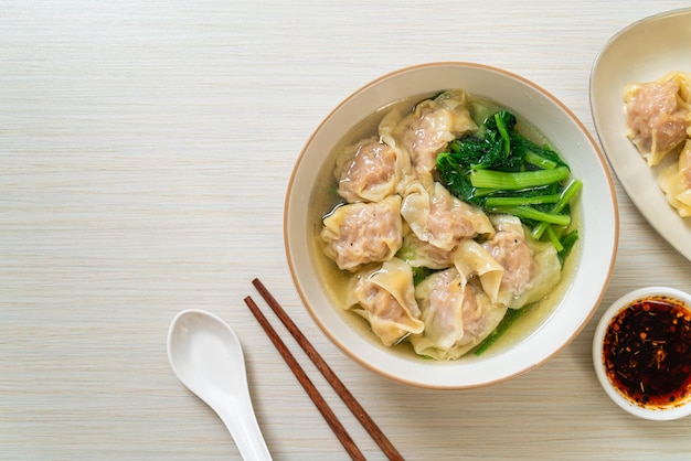 pork wonton soup or pork dumplings soup with vegetable - Asian food style