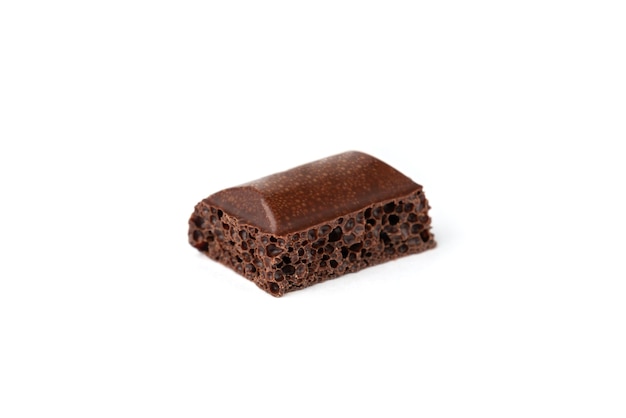 Porous dark chocolate isolated.