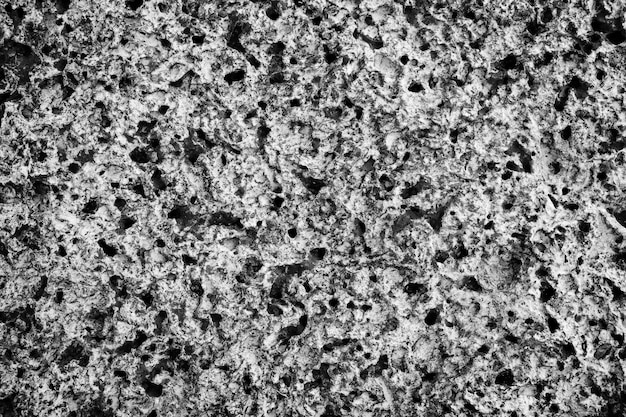 다공성 바위 사암 질감 배경입니다. 해변에서 돌의 표면입니다. 자연적으로 발생하는 고체 질량