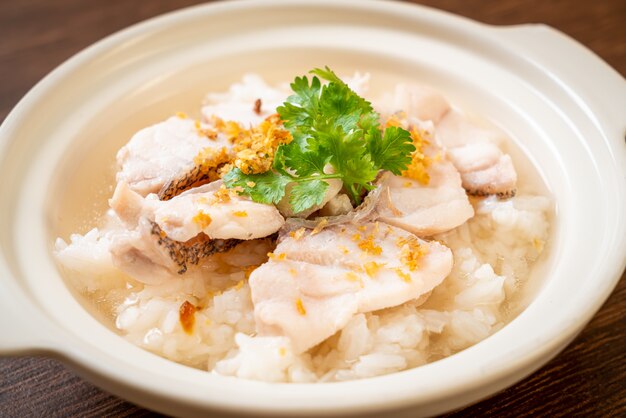 porridge or boiled rice soup with fish bowl