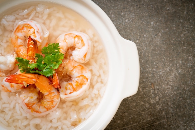 porridge or boiled rice soup with shrimps bowl