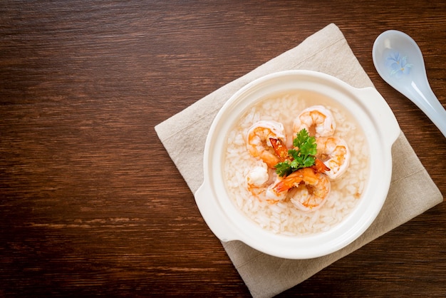 porridge or boiled rice soup with shrimps bowl