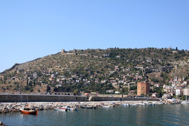 Port Alanya and red brick tower