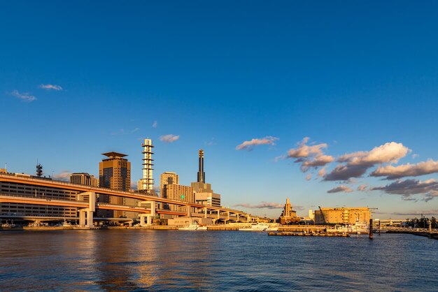 Port of Kobe city skyline view in sun set time with clear blue sky background