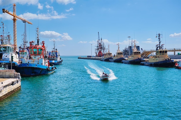 Port of Lisbon with moored tugboats on sunny day Tagus river Lisbon Portugal