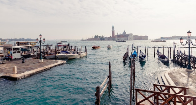 Port of Venice in Italy moored boats and gondolas