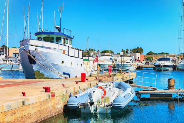 Port with ships and yachts at Villasimius, Cagliari, South Sardinia in Italy