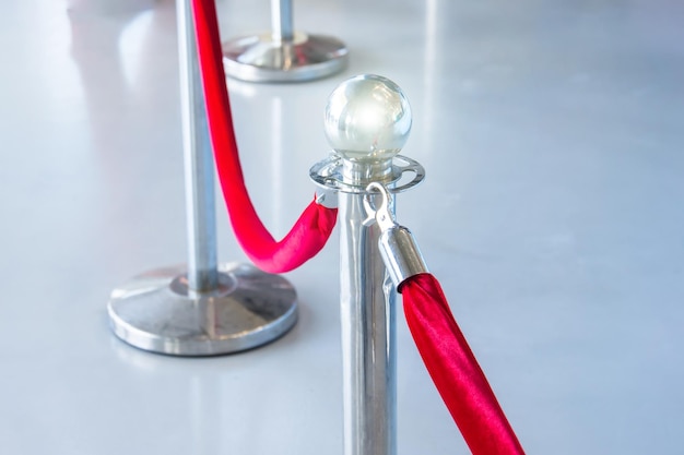 Portable Barrier for Queue Control Red security rope by red carpet