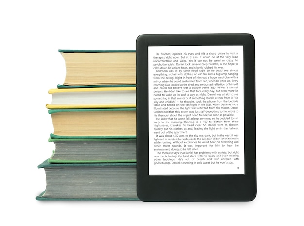 Photo portable ebook and stack of hardcover books on white background