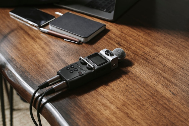 Portable sound recorder on a wooden table