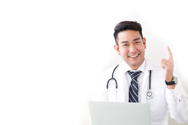 Portait of Asian doctor in hospital white  