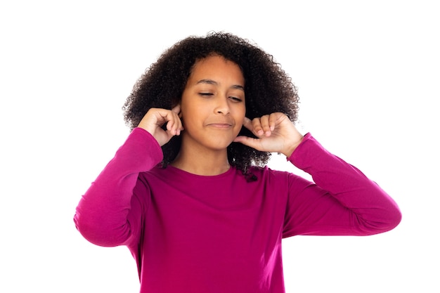 Portait of a teenage with afro hair isolated on a white wall