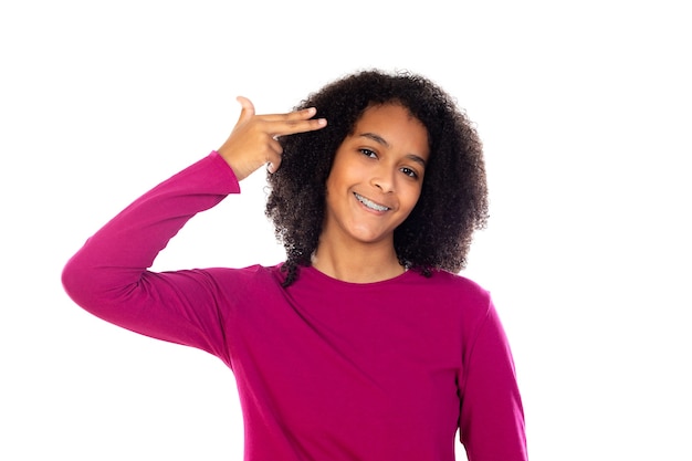 Portait of a teenage with afro hair isolated on a white wall