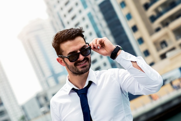 Portait of young man in white shirt and black tie