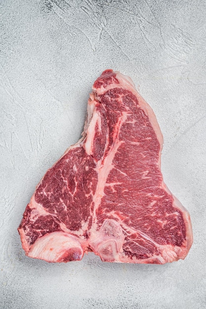 Porterhouse Tbone rauw rundvlees Steak Witte achtergrond Bovenbeeld