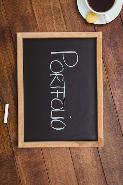 Photo portfolio against a big blackboard