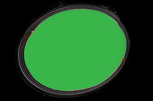 Porthole of space station isolated on green