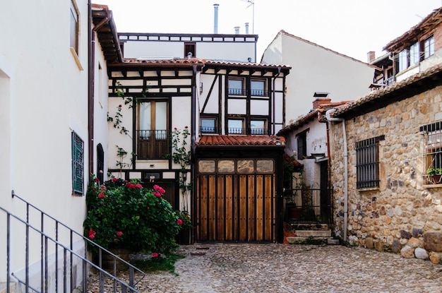 Portico of a typical white adobe and halftimbered house in covarrubias Burgos Castilla y Leon Spain