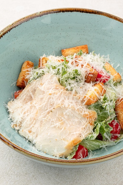 Portion of caesar salad with chicken