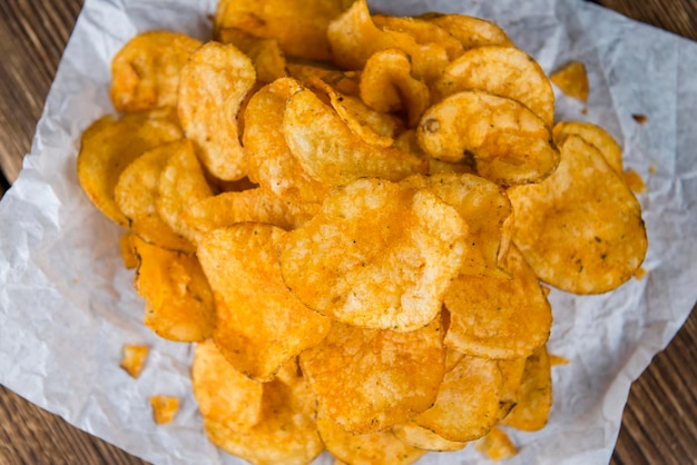 Portion of crispy Potato Chips selective focus