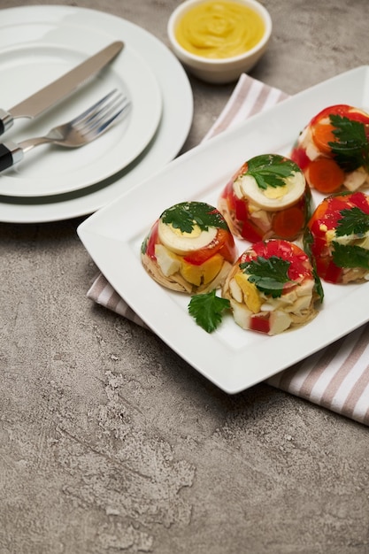 Portion of delicious chicken aspic on a plate isolated on concrete table