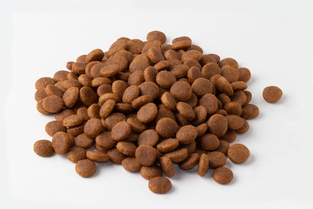 Portion of dry dog food isolated on white background