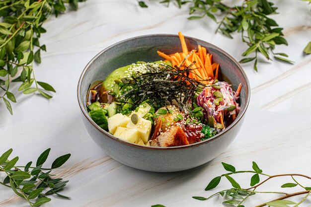 Photo portion of eel poke bowl with vegetables