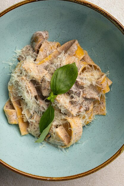 portion of fettuccine pasta alfredo with chicken