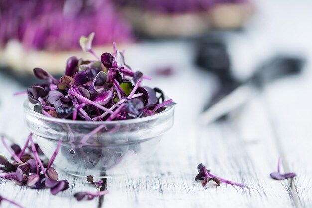 Portion of Fresh cutted Cress on wooden background selective focus