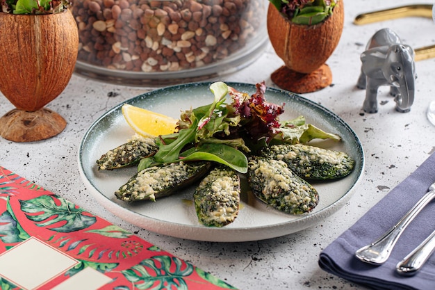 Portion of gourmet stuffed mussels appetizer