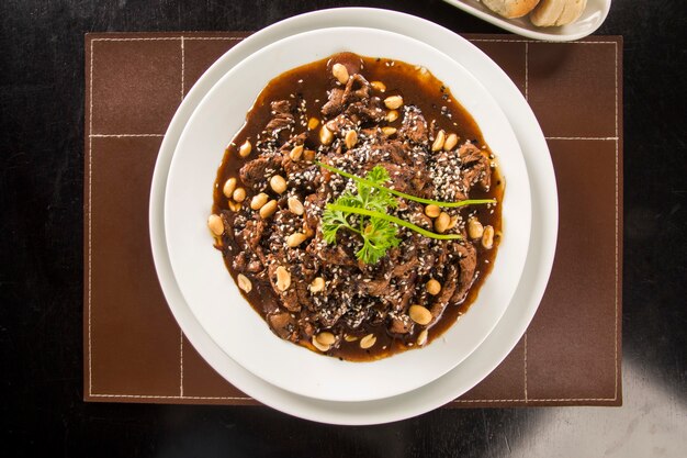 portion of meat with almond sauce