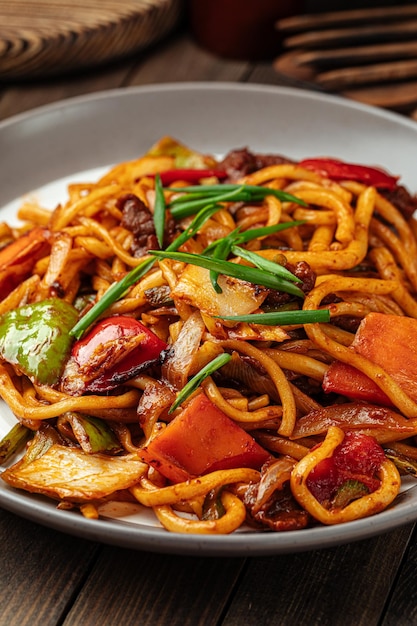 Portion of oriental dish tsomyan roasted noodles