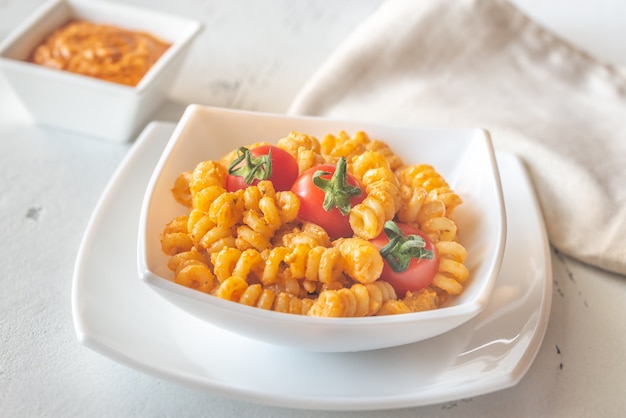 Portion of pasta with tomato and ricotta pesto