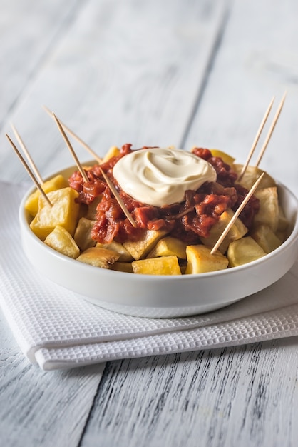 Portion of patatas bravas with sauces