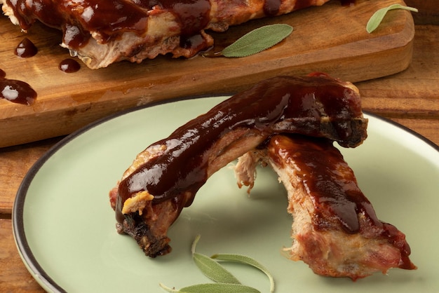 Portion of pork ribs covered with barbecue sauce