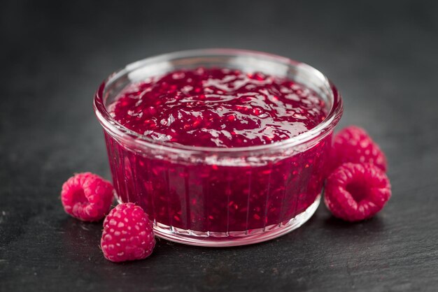 Portion of Raspberry Jam on a slate slab